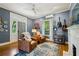 Cozy living room showcases two leather armchairs, a decorative rug, and an artistic accent wall at 797 Ashland Ne Ave, Atlanta, GA 30307