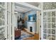 Cozy living room featuring a fireplace, hardwood floors, and stylish decor, viewed from dining room at 797 Ashland Ne Ave, Atlanta, GA 30307