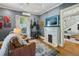 Comfortable living room featuring a marble fireplace, hardwood floors, and stylish decor at 797 Ashland Ne Ave, Atlanta, GA 30307