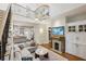 Spacious living room with fireplace, open staircase, and an open concept to the adjacent kitchen at 797 Ashland Ne Ave, Atlanta, GA 30307