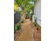 Gravel side yard with stepping stone border and manicured landscaping at 797 Ashland Ne Ave, Atlanta, GA 30307