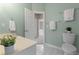 Bathroom featuring a toilet and vanity with a doorway to the bedroom in the background at 290 Bluff Oak Dr, Roswell, GA 30076