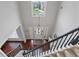 Spacious entryway featuring hardwood floors, staircase, and chandelier at 290 Bluff Oak Dr, Roswell, GA 30076