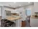 Bright and modern kitchen with granite countertops, stainless steel appliances, and bar seating at 290 Bluff Oak Dr, Roswell, GA 30076
