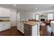 Open kitchen with granite countertops, stainless steel appliances, and view to the living room at 290 Bluff Oak Dr, Roswell, GA 30076