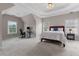 Spacious main bedroom with tray ceiling, ceiling fan, ensuite bathroom, and walk-in closet at 290 Bluff Oak Dr, Roswell, GA 30076