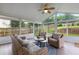 Sunroom with ample seating and views of the backyard at 290 Bluff Oak Dr, Roswell, GA 30076