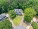 Aerial view of the home surrounded by lush greenery on a spacious lot in a quiet neighborhood at 308 Golden Ct, Canton, GA 30114