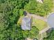 Overhead view of house showing the roof, driveway, and expansive, tree-filled surroundings at 308 Golden Ct, Canton, GA 30114