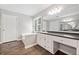 Bright bathroom featuring tub, shower, and white vanity with granite countertop at 308 Golden Ct, Canton, GA 30114