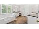 Bathroom with soaking tub and dual vanities at 308 Golden Ct, Canton, GA 30114
