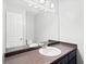 Well-lit bathroom with a large mirror and single sink vanity at 308 Golden Ct, Canton, GA 30114
