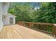 Large wooden deck with room to relax and a view of the wooded back yard at 308 Golden Ct, Canton, GA 30114
