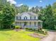 Charming two-story home with a welcoming front porch and well-manicured lawn at 308 Golden Ct, Canton, GA 30114