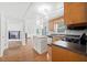 Charming kitchen with a center island and hardwood floors, open to the living room at 308 Golden Ct, Canton, GA 30114