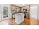 Kitchen featuring a central island, stainless steel appliances, and hardwood floors at 308 Golden Ct, Canton, GA 30114