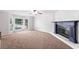 Spacious living room featuring large windows and a charming fireplace at 308 Golden Ct, Canton, GA 30114
