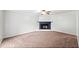 Cozy living room with carpet, a ceiling fan and a decorative fireplace at 308 Golden Ct, Canton, GA 30114