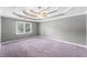 Spacious main bedroom with tray ceiling and ceiling fan at 308 Golden Ct, Canton, GA 30114