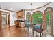 Cozy breakfast nook features expansive windows with views to the outdoors and custom cabinetry at 335 S Satinwood Pl, Roswell, GA 30076
