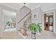 Elegant foyer with a staircase, chandelier, and views into other rooms at 335 S Satinwood Pl, Roswell, GA 30076