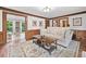Spacious living room with neutral decor, hardwood floors, and an open layout at 335 S Satinwood Pl, Roswell, GA 30076