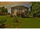 A beautiful multi-story home boasts a spacious backyard and a wooden deck at 5121 Hope Sw Ct, Lilburn, GA 30047