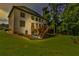 A beautiful multi-story home boasts a spacious backyard and a wooden deck at 5121 Hope Sw Ct, Lilburn, GA 30047