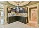 This finished basement bar boasts custom cabinets, a wine rack, and stylish tile backsplash at 5121 Hope Sw Ct, Lilburn, GA 30047