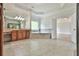 This bathroom is designed with a bathtub, double vanities, and tile flooring at 5121 Hope Sw Ct, Lilburn, GA 30047