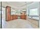 This primary bathroom is equipped with double vanities, a soaking tub, and a tile floor at 5121 Hope Sw Ct, Lilburn, GA 30047