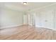 Spacious bedroom with hardwood floors and large closets, offering ample storage at 5121 Hope Sw Ct, Lilburn, GA 30047