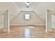 The bonus room includes hardwood floors, lots of wall space, and plenty of light at 5121 Hope Sw Ct, Lilburn, GA 30047