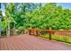 Large wooden deck overlooking the backyard offers plenty of space for outdoor enjoyment at 5121 Hope Sw Ct, Lilburn, GA 30047