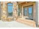 Stone and brick entrance with a double front door and transom window, with brick steps at 5121 Hope Sw Ct, Lilburn, GA 30047