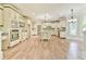 Elegant kitchen with custom cabinets, marble countertops, large island, and stainless steel appliances at 5121 Hope Sw Ct, Lilburn, GA 30047