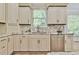 Kitchen with custom cabinets and stainless steel dishwasher at 5121 Hope Sw Ct, Lilburn, GA 30047