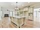 Kitchen with hardwood floors, granite countertops, large island, and custom cabinets at 5121 Hope Sw Ct, Lilburn, GA 30047
