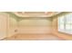 Living room with panel molding, window and tiled floor at 5121 Hope Sw Ct, Lilburn, GA 30047