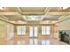 A spacious living room features coffered ceilings, fireplace, and bright windows at 5121 Hope Sw Ct, Lilburn, GA 30047