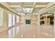 Bright living room boasts coffered ceilings, fireplace, built-ins, and French doors at 5121 Hope Sw Ct, Lilburn, GA 30047