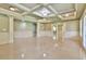 Open concept living area with elegant trim work, columns, and bright, reflective floors at 5121 Hope Sw Ct, Lilburn, GA 30047
