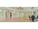Spacious living room with trim work, archways, dining area and marble-look floors at 5121 Hope Sw Ct, Lilburn, GA 30047