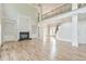 Open floor plan living room boasts high ceilings, fireplace, and grand staircase with iron railing at 5121 Hope Sw Ct, Lilburn, GA 30047