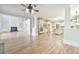 Open floor plan with fireplace, hardwood floors, columns and a view to the kitchen area at 5121 Hope Sw Ct, Lilburn, GA 30047