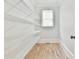 Pantry with white metal shelving and hardwood floors at 5121 Hope Sw Ct, Lilburn, GA 30047