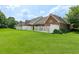 Expansive backyard surrounded by mature trees and a white fence providing ultimate privacy at 5250 Villa Lake Ct, Suwanee, GA 30024