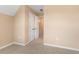Neutral bedroom featuring double doors and carpeted floors, perfect for relaxation and comfort at 5250 Villa Lake Ct, Suwanee, GA 30024