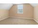 The neutral bedroom has carpet and a window that provides natural light at 5250 Villa Lake Ct, Suwanee, GA 30024