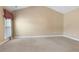 Spacious carpeted bedroom featuring a large window and a vaulted ceiling at 5250 Villa Lake Ct, Suwanee, GA 30024